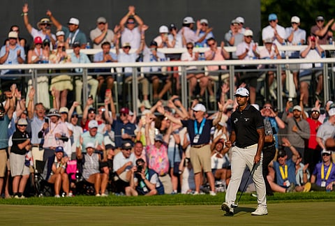 Aaron Rai, of England, celebrates after his shot on the 17th green during the final round of the PGA Championship golf tournament at Aronimink Golf Club, in Newtown Square, Pennsylvania.