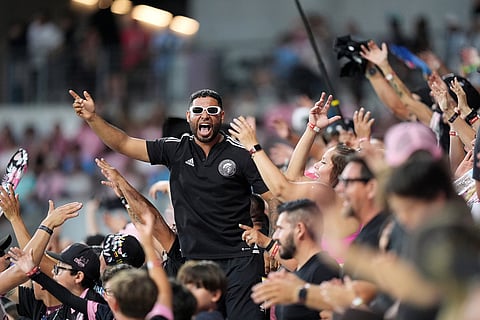 Inter Miami fans cheer during the second half of an MLS soccer match against the Portland Timbers in Miami.