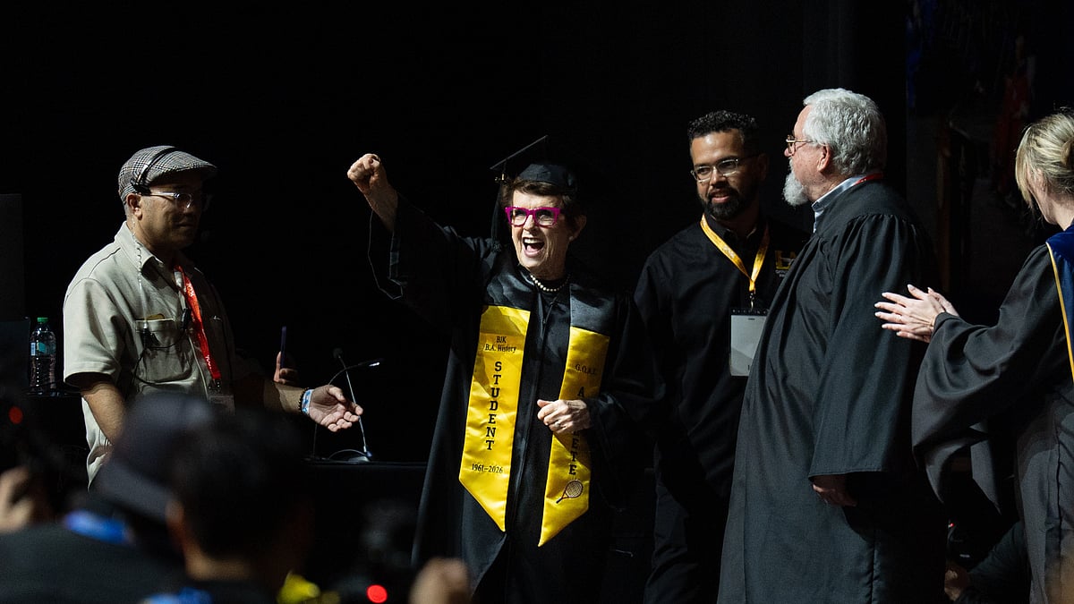 Tennis legend Billie Jean King raises her fist after being called to receive her diploma during California State University, Los Angeles, commencement in Los Angeles, Monday, May 18, 2026. - AP Photo/Jae C. Hong