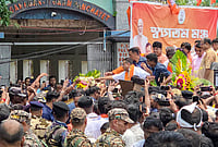 | Photo: Handout via PTI : West Bengal Chief Minister Suvendu Adhikari holds a roadshow in support of BJP candidate for the Falta constituency, Debangshu Panda, on the final day of campaigning for the May 21 repoll, in South 24 Parganas. 