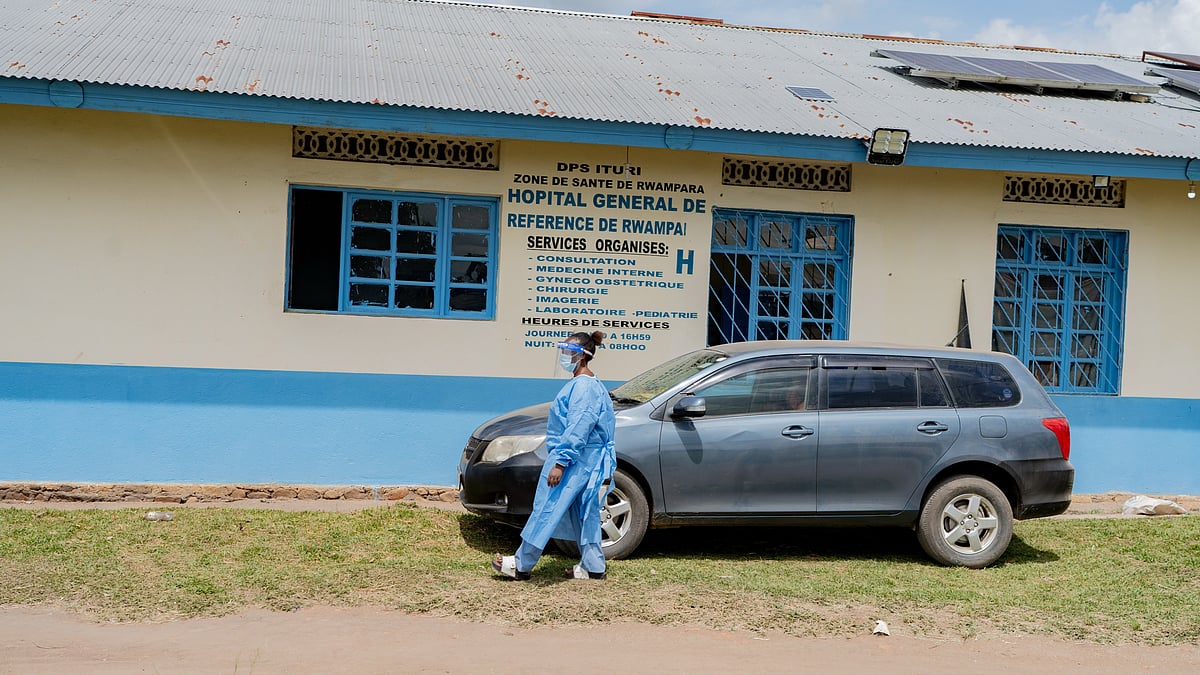 A health worker wearing protective gear walks outside the a hospital in Bunia, Congo, Saturday, May 16, 2026. - AP