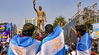 | Photo: PTI/Manvender Vashist Lav : Fans cheer during the unveiling of Argentine footballer Lionel Messi's 70-feet statue, in Kolkata. Messi virtually unveiled the statue as part of his 'G.O.A.T. India Tour 2025'.