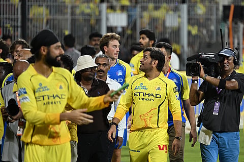 Chennai Super Kings' Mahendra Singh Dhoni with teammates greets his fans after the Indian Premier League cricket match against Sunrisers Hyderabad in Chennai, India.