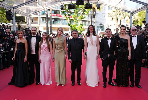 Lisa Carlehed, from left, Sebastian Stan, Vanessa Ceban, Henrikke Lund Olsen, director Cristian Mungiu, Renate Reinsve, Jonathan Ciprian Breazu, Lisa Loven Kongsli and Markus Tønseth pose for photographers upon arrival at the premiere of the film 'Fjord' at the 79th international film festival, Cannes, southern France.