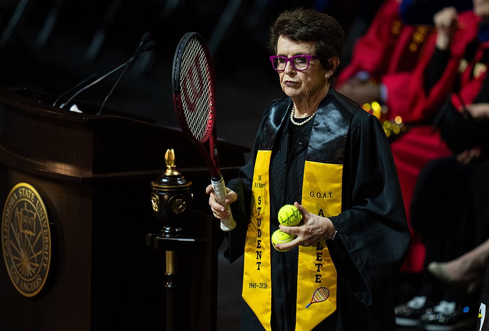 Tennis legend Billie Jean King, prepares to toss tennis balls to graduates after delivering remarks during a California State University, Los Angeles, commencement ceremony in Los Angeles. - | Photo: AP/Jae C. Hong
