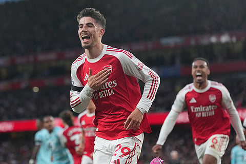Arsenal's Kai Havertz celebrates after scoring during a Premier League soccer match between Arsenal and Burnley in London.