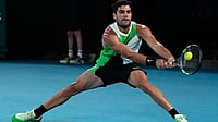 Carlos Alcaraz Withdraws From Wimbledon Because Of Lingering Wrist Injury File/AP : Carlos Alcaraz of Spain plays a backhand return to Alex de Minaur of Australia during their quarterfinal match at the Australian Open tennis championship in Melbourne