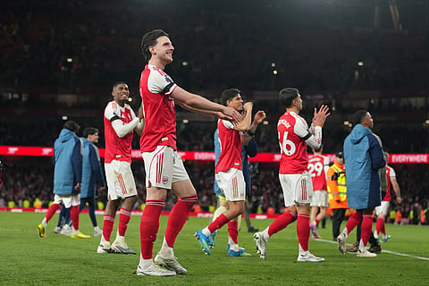 Arsenal players walk off the pitch after a Premier League soccer match between Arsenal and Burnley in London.
