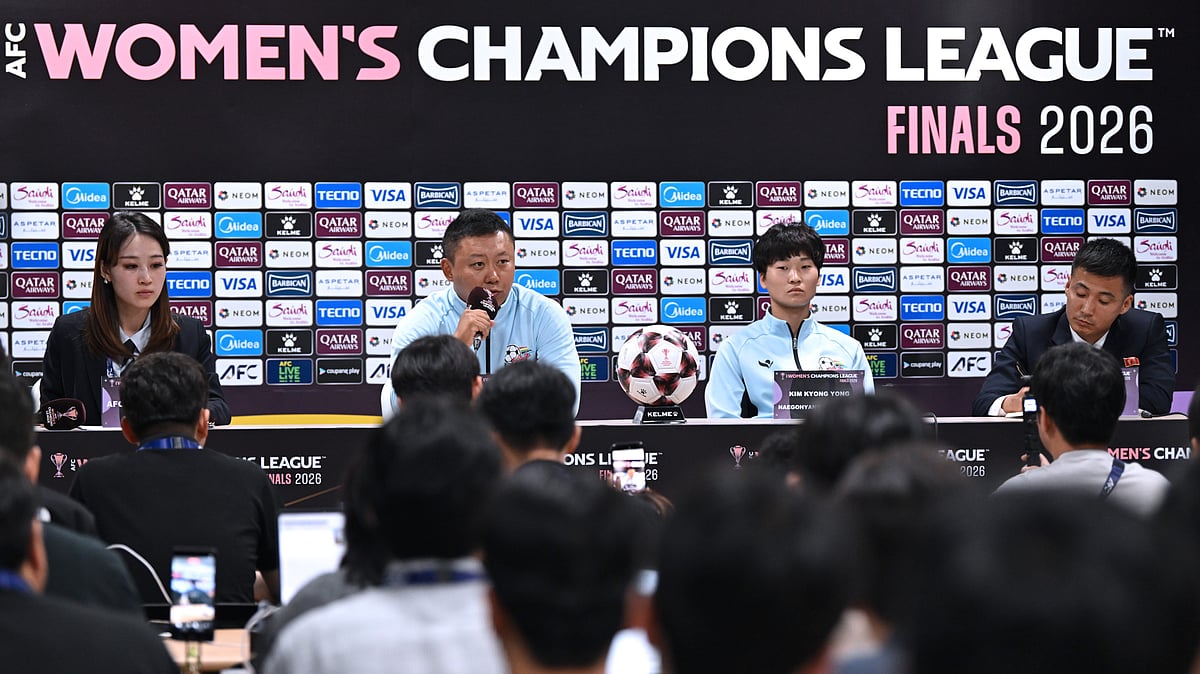 North Korea's Naegohyang Women's FC head coach Ri Yu Il, center left, and his player Kim Kyong Yong, center right, attend a press conference at Suwon Sports Complex in Suwon Tuesday, May 19, 2026, ahead of the Women's Asian Champions League semi-final football match against South Korea's Suwon FC Women. - | Photo: Jung Yeon-je/Pool Photo via AP