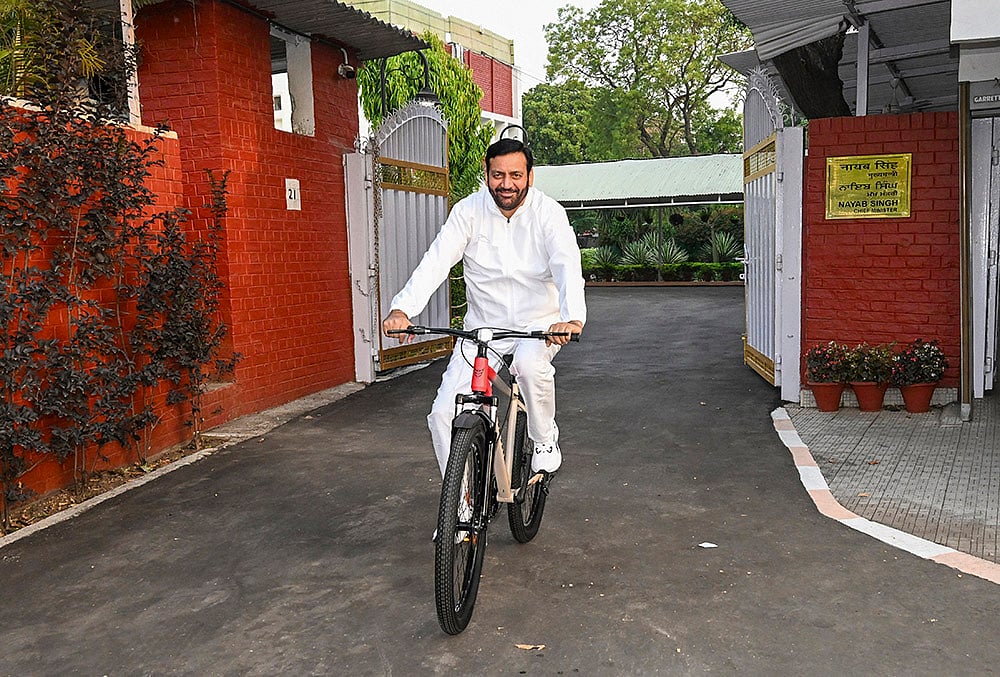 Nayab Saini moves on a bicycle