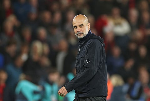 Manchester City's head coach Pep Guardiola leaves the field at the end of the English Premier League soccer match between AFC Bournemouth and Manchester City in Bournemouth, England.