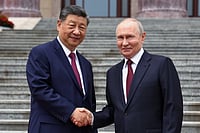 Xi Welcomes ‘Dear Friend’ Putin, Showcases Russia-China Unity and Takes Veiled Swipe at US Dominance Alexander Kazakov : Russian President Vladimir Putin, right, and Chinese President Xi Jinping shake hands during a welcome ceremony at the Great Hall of the People, in Beijing, China, on Wednesday, May 20, 2026.