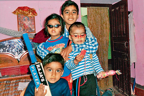 Sooryavanshi (holding a bat) with his brothers and friend at his home
