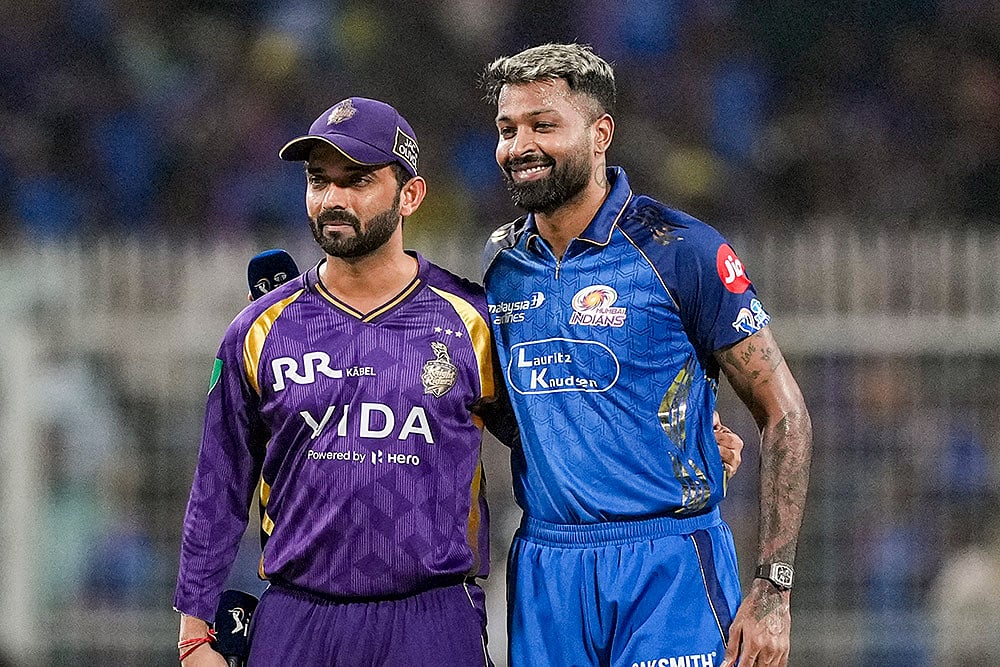 Mumbai Indians' captain Hardik Pandya, right, and Kolkata Knight Riders' captain Ajinkya Rahane during the toss before an Indian Premier League (IPL) 2026 T20 cricket match between Kolkata Knight Riders and Mumbai Indians, in Kolkata, West Bengal. - | Photo: PTI/Swapan Mahapatra