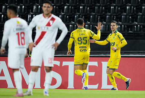 Shaylon of Brazil's Mirassol, right, celebrates scoring his side's first goal against Bolivia's Always Ready during a Copa Libertadores Group G soccer match in Asuncion, Paraguay.