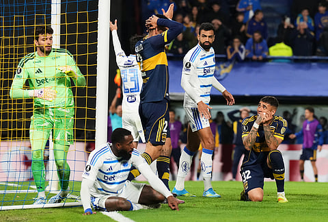 Lautaro Di Lollo, center, and Ayrton Costa, right, of Argentina's Boca Juniors react after missing a chance to score against Brazil's Cruzeiro during a Copa Libertadores Group D soccer match in Buenos Aires, Argentina.