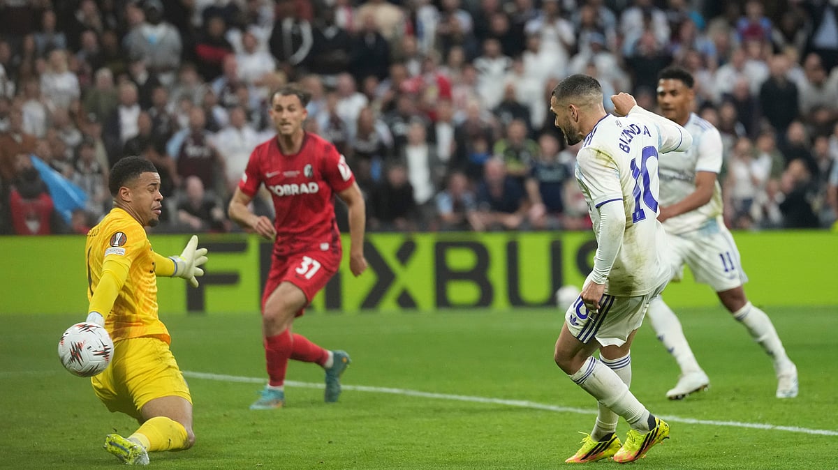 Freiburg's goalkeeper Noah Atubolu, left, saves a ball after a shot by Aston Villa's Emiliano Buendia during the Europa League final soccer match between Freiburg and Aston Villa in Istanbul, Turkey. - AP Photo