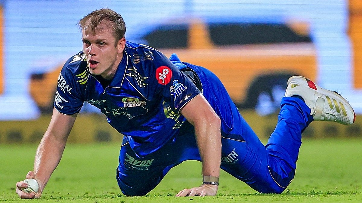 Corbin Bosch goes to the ground after taking stunning catch to dismiss Rovman Powell.  - mipaltan/X