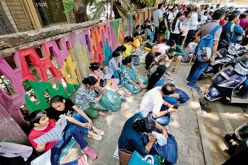 Parents of students appearing for the NEET exam outside a test centre in Vashi, on May 3, 2026 