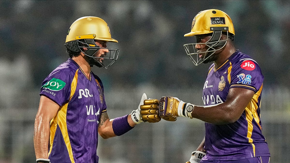 Kolkata Knight Riders' Manish Pandey, and Rovman Powell toss during the Indian Premier League cricket match between Kolkata Knight Riders and Mumbai Indians, in Kolkata. - AP Photo