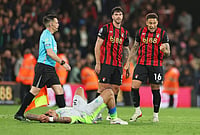 Bournemouth 1-1 Man City, EPL: Pep Guardiola's MCFC Held By Cherries To Hand Arsenal Title | Photo: AP/Ian Walton : Manchester City's Nico O'Reilly lies on the pitch as Bournemouth's Marcus Tavernier, right, and Bournemouth's Marcos Senesi react after the English Premier League soccer match between AFC Bournemouth and Manchester City in Bournemouth, England.
