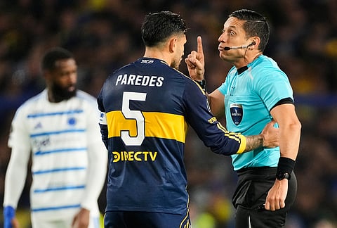 Referee Jesus Valenzuela talks to Leandro Paredes of Argentina's Boca Juniors during a Copa Libertadores Group D soccer match against Brazil's Cruzeiro in Buenos Aires, Argentina.
