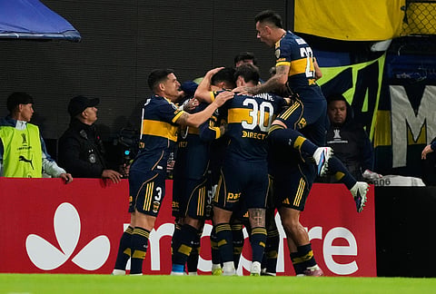 Players of Argentina's Boca Juniors celebrate after Miguel Merentiel scored his side's first goal against Brazil's Cruzeiro during a Copa Libertadores Group D soccer match in Buenos Aires, Argentina.