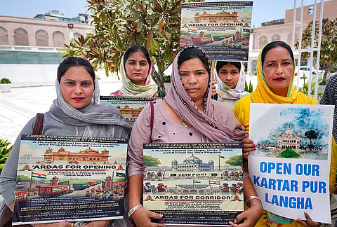 Members of the World Sikh Chamber of Commerce, and others, during the 'Ardas for Opening of International Trade Through Attari Border' campaign, outside the Golden Temple, in Amritsar, Punjab.