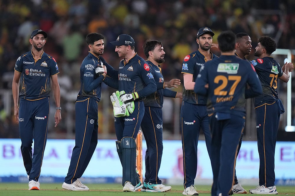 | Photo: AP/Ajit Solanki : Gujarat Titans' players celebrate their win in the Indian Premier League cricket match between Gujarat Titans and Chennai Super Kings in Ahmedabad, India.