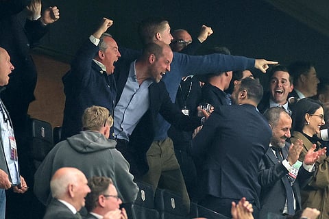 Britain's Prince William, center, celebrates as he watches the Europa League final soccer match between Freiburg and Aston Villa in Istanbul, Turkey.