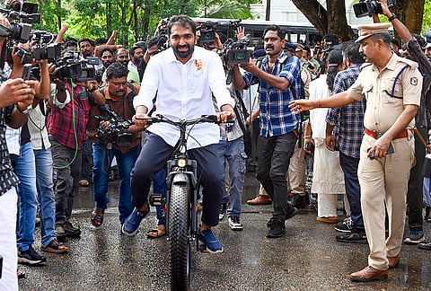 Congress MLA elect from Puthuppally Chandy Oommen, son of former Kerala CM Oommen Chandy, arrives on a bicycle before the swearing-in ceremony of the newly elected MLAs of the 16th state Legislative Assembly, in Thiruvananthapuram.