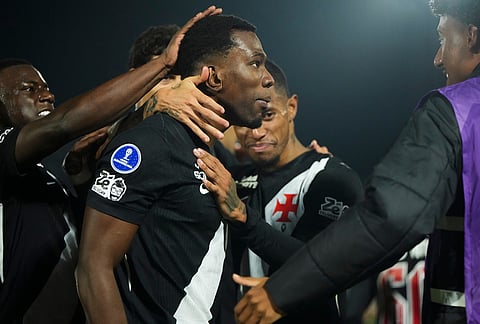 Carlos Cuesta of Brazil's Vasco da Gama, center, celebrates with teammates after scoring his side's opening goal against Paraguay's Olimpia during a Copa Sudamericana Group G soccer match in Asuncion, Paraguay.