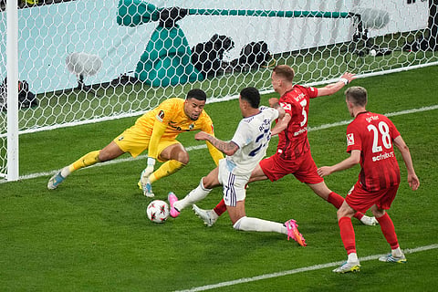 Aston Villa's Morgan Rogers scores his side's third goal during the Europa League final soccer match between Freiburg and Aston Villa in Istanbul, Turkey.
