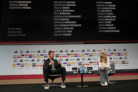 Germany's head coach Julian Nagelsmann, left, speaks with DFB media spokeswoman Franziska Wuelle as he announces the squad for the 2026 FIFA World Cup during a news conference at the German Football Association, DFB, headquarters in Frankfurt, Germany.