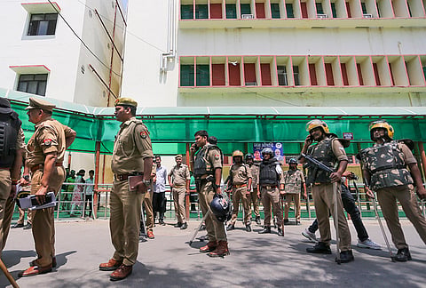 Police personnel deployed at the site as junior doctors of Swaroop Rani Nehru (SRN) Hospital stage a protest after a clash broke out between lawyers and junior doctors following a dispute over a patient's treatment, in Prayagraj, Uttar Pradesh.
