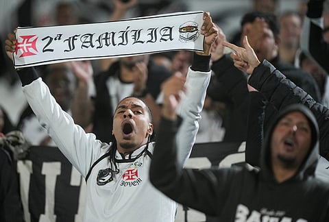 Fans of Brazil's Vasco da Gama cheer their team on from the stands during a Copa Sudamericana Group G soccer match against Paraguay's Olimpia in Asuncion, Paraguay.
