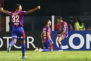 | Photo: AP/Mauricio de Souza : Rodrigo Auzmendi of Argentina's San Lorenzo, center, celebrates scoring his side's second goal against Brazil's Santos during a Copa Sudamericana Group D soccer match in Santos, Brazil.