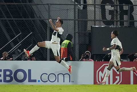 Hugo Sandoval of Paraguay's Olimpia celebrates after scoring his side's second goal against Brazil's Vasco da Gama during a Copa Sudamericana Group G soccer match in Asuncion, Paraguay.