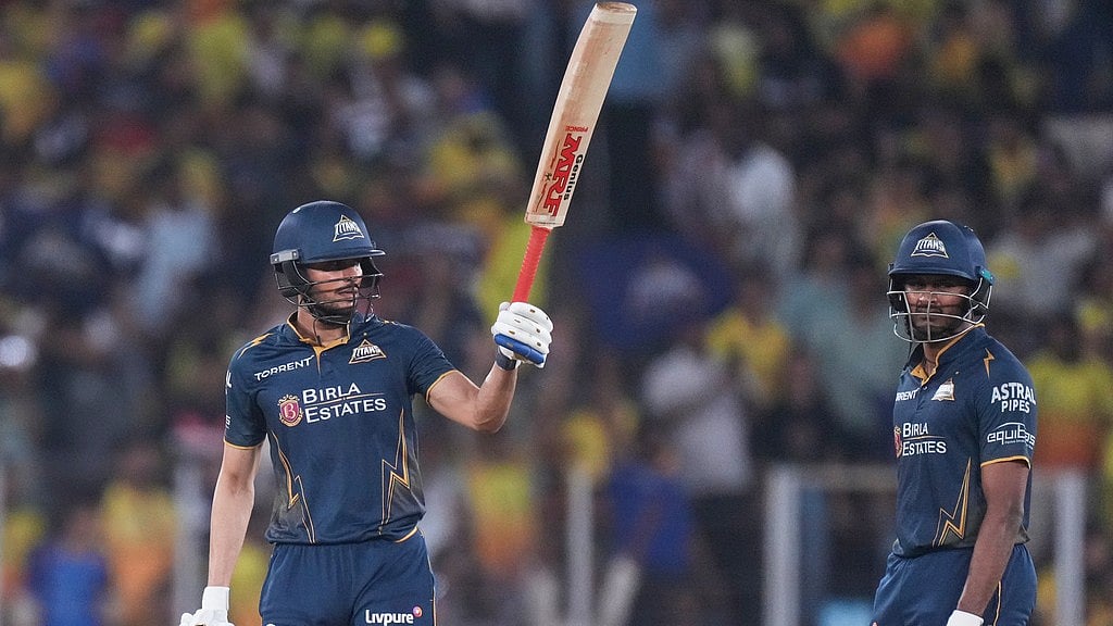 Gujarat Titans' captain Shubman Gill celebrates his fifty runs as Sai Sudharsan watches during the Indian Premier League cricket match between Gujarat Titans and Chennai Super Kings in Ahmedabad, India, Thursday, May 21, 2026. - AP Photo/Ajit  Solanki