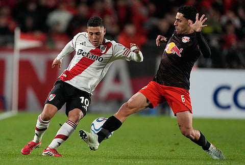 Juan Quintero of Argentina's River Plate (10) and Gabriel Girotto of Brazil's Red Bull Bragantino battle for the ball during a Copa Sudamericana Group H soccer match in Buenos Aires, Argentina.