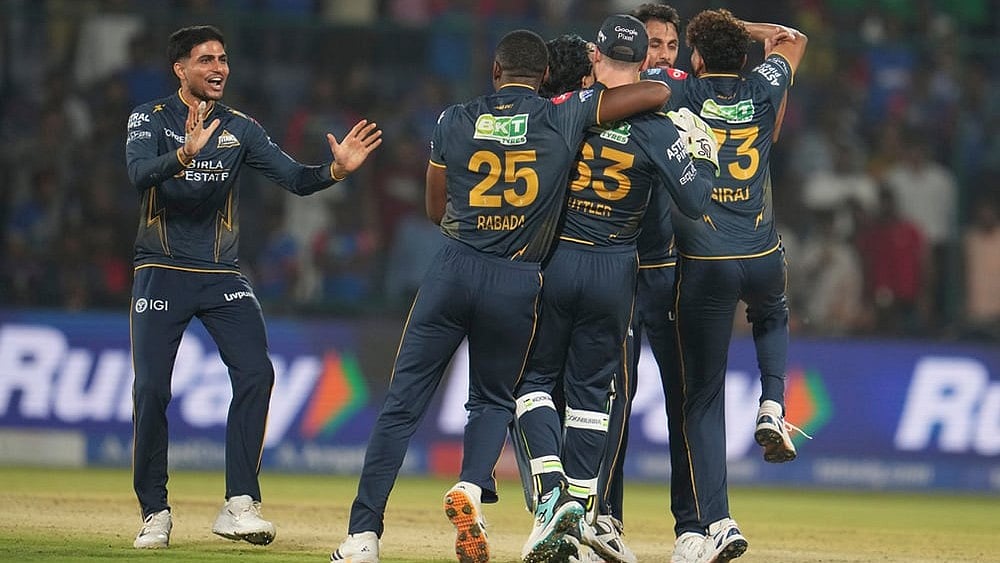 Gujarat Titans' captain Shubman Gill, left, along with his teammates celebrates after they won the Indian Premier League cricket match against Delhi Capitals in New Delhi. - | Photo: AP/Manish Swarup