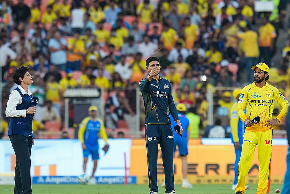 Gujarat Titans' captain Shubman Gill flips the coin as Chennai Super Kings' captain Ruturaj Gaikwad, right, looks on during the toss ahead of the Indian Premier League (IPL) 2026 T20 cricket match between Gujarat Titans and Chennai Super Kings, in Ahmedabad, Gujarat. - | Photo: PTI/Karma Bhutia