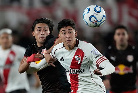 Facundo Gonzalez of Argentina's River Plate, right, and Jose Herrera of Brazil's Red Bull Bragantino view the ball during a Copa Sudamericana Group H soccer match in Buenos Aires, Argentina.