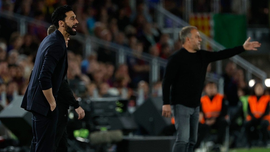 Real Madrid head coach Alvaro Arbeloa and Barcelona head coach Hansi Flick give instructions to the players, during their Spanish La Liga match in Barcelona. - AP/Joan Monfort