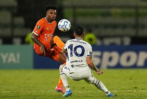 Yackson Rivas of Venezuela's Deportivo La Guaira, left, and Matias Fernadez of Argentina's Independiente Rivadavia battle for the ball during a Copa Libertadores Group C soccer match in Caracas, Venezuela.