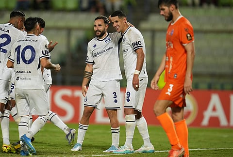 Alex Arce of Argentina's Independiente Rivadavia, 2nd right, celebrates with teammates scoring his side's 4th goal against Venezuela's Deportivo La Guaira during a Copa Libertadores Group C soccer match in Caracas, Venezuela.