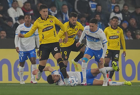 Justo Giani of Chile's Universidad Catolica falls on the pitch during a Copa Libertadores Group D soccer match in Santiago, Chile.