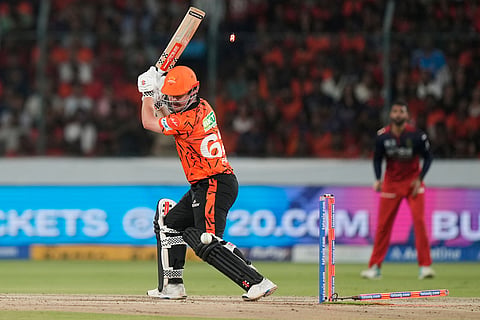 Sunrisers Hyderabad's Travis Head bowled out by Royal Challengers Bengaluru's Rasikh Dar during the Indian Premier League cricket match between Sunrisers Hyderabad and Royal Challengers Bengaluru in Hyderabad, India.