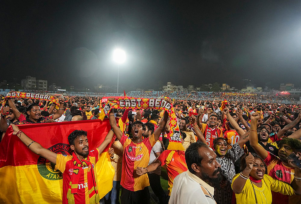 | Photo: PTI/Swapan Mahapatra : East Bengal supporters celebrate after their team’s victory in the Indian Super League (ISL) 2026 football match against Inter Kashi, in Kolkata.