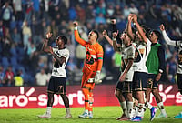 | Photo: AP/Eduardo Verdugo : Pumas' players greet fans after the Mexican soccer league first leg final match against Cruz Azul in Mexico City.